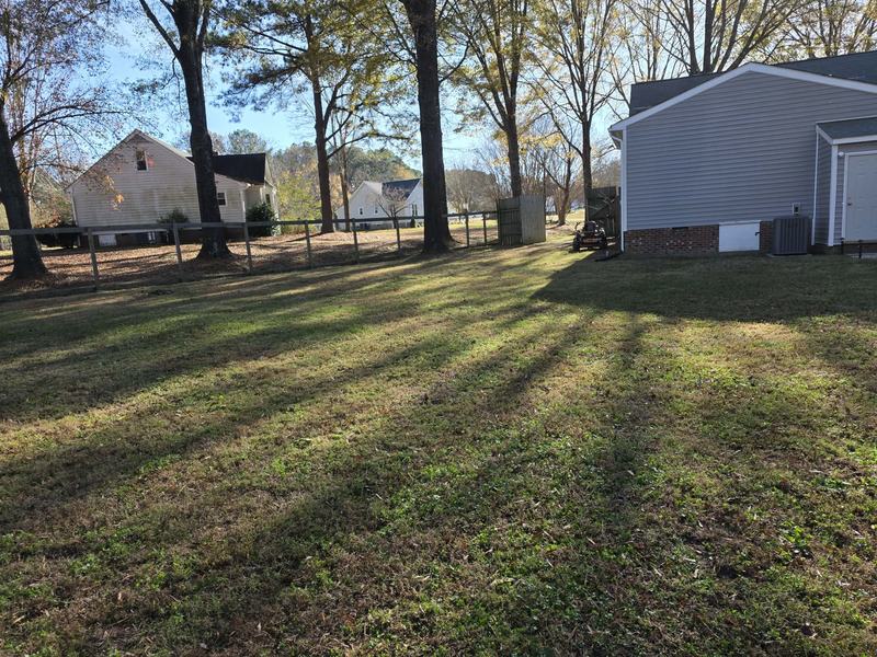 Backyard leaf removal after seasonal cleanup by Good Life Landscapes