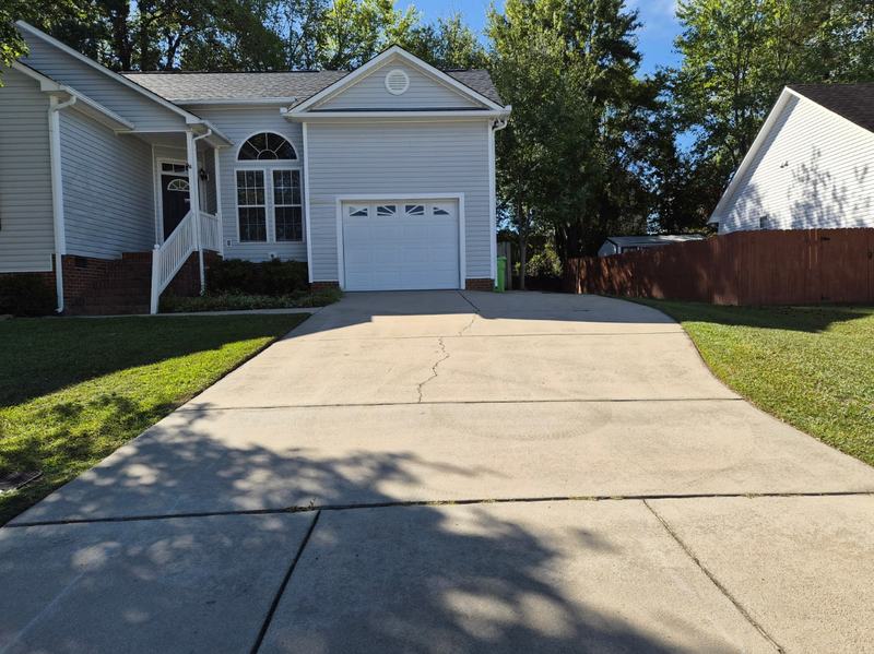 Driveway and front lawn after seasonal cleanup by Good Life Landscapes